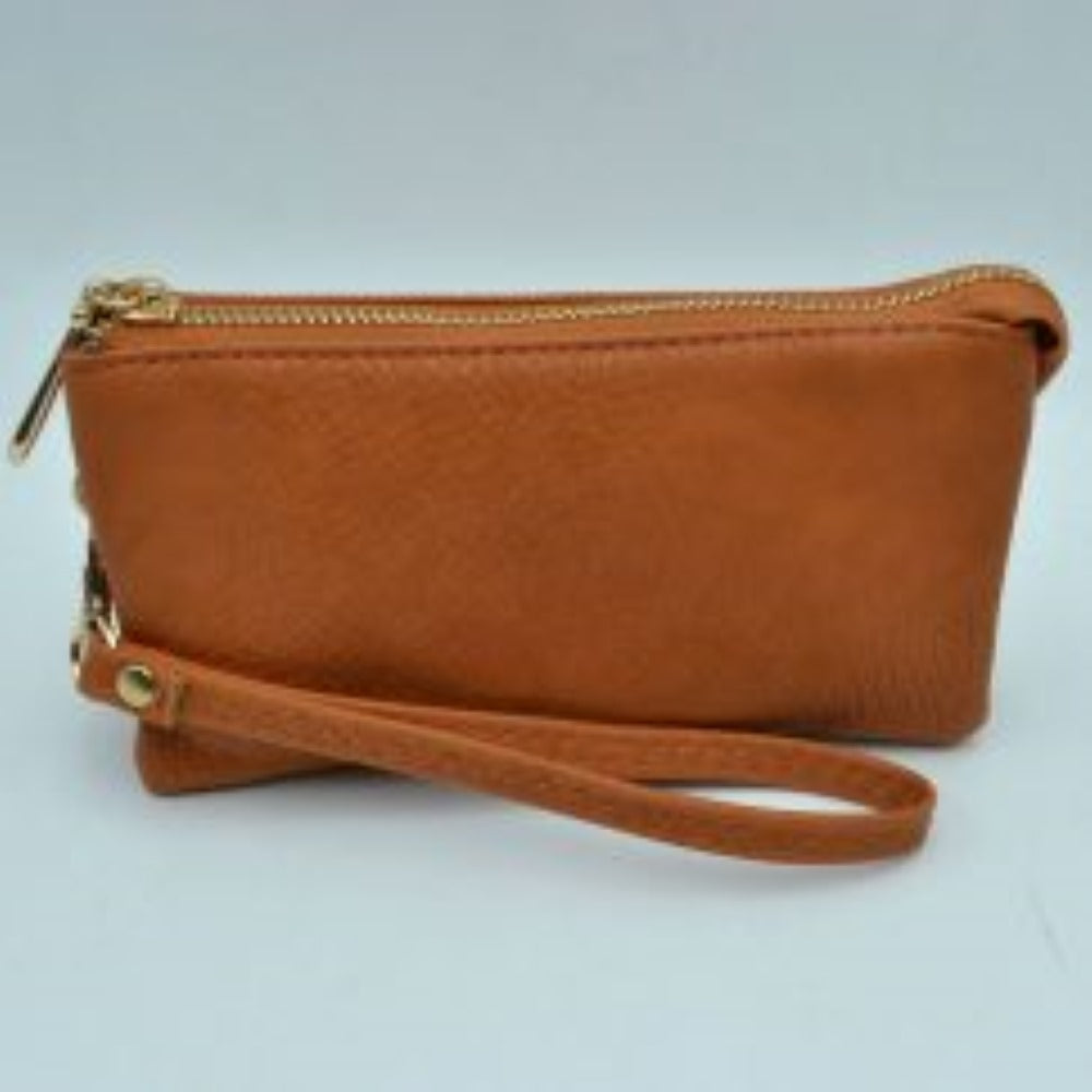 Brown This sleek pouch features a textured, pebble-grained finish and a slim rectangular silhouette suitable for organized everyday use. It is designed with secure top zipper storage compartments to keep your daily essentials protected while on the go, accented by a distinct metallic teardrop-shaped zipper pull. A matching detachable wristlet strap with detailed zig-zag stitching connects securely via a metallic clasp, providing a convenient and stylish option for handheld carrying.