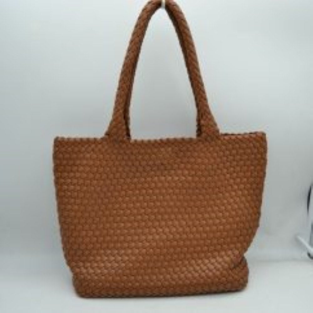 Brown This structured tote bag features an intricate basket-weave design across its body and integrated shoulder straps, creating a textured look suitable for everyday use. The main storage compartment offers a wide, open-top design for easy access to daily essentials. Accompanying the larger bag is a matching smaller pouch with a distinct woven exterior pattern and a secure gold-tone top zipper closure to keep smaller items organized.