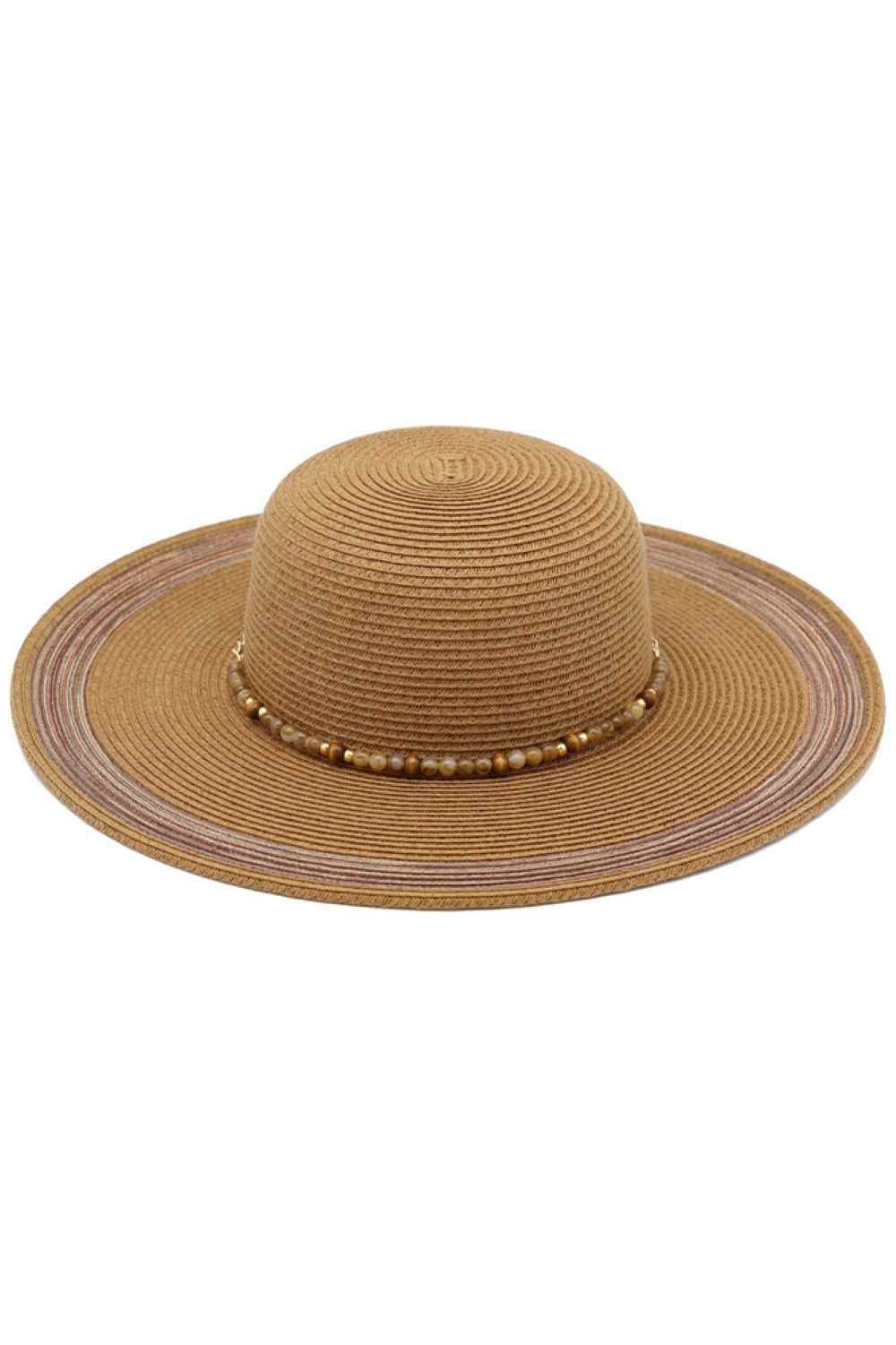 Brown Protect yourself in style with this charming summer straw sun hat, featuring a striking turquoise stone-beaded band. Crafted from a breathable blend of 80% paper and 20% polyester, it offers lightweight comfort for all-day wear. The UPF 50+ UV protection shields your face and neck from harmful sun rays, making it perfect for beach days, outdoor events, and sunny adventures. Whether you're lounging poolside or exploring a new destination, this versatile hat combines practical sun protection with effort