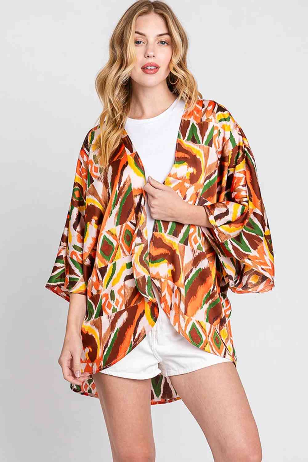 Brown Effortless bohemian style meets everyday versatility with this lightweight cover-up cardigan. Featuring an eye-catching boho print, it drapes beautifully over any outfit for an instant layered look. Crafted from 100% polyester for easy care and comfort, this piece measures 44" x 31" for a relaxed, flowing fit. Perfect for beach days, casual outings, or adding a touch of free-spirited flair to your wardrobe.