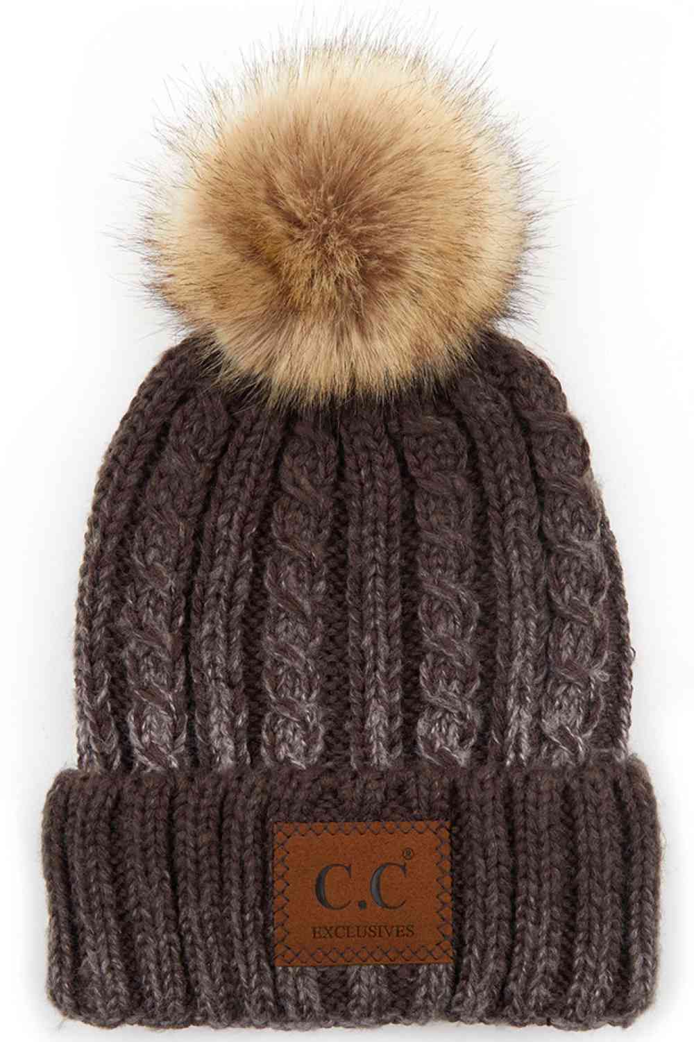 Brown Elevate your winter wardrobe with this C.C ombre beanie featuring a plush faux fur pom. Crafted from 100% acrylic, the soft knit construction provides warmth and comfort without bulk. Perfect for casual outings or layering under winter gear.