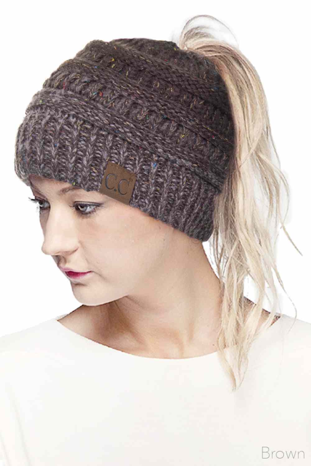 Brown Stay cozy and stylish with the C.C Ombre Confetti Messy Bun Ponytail Beanie. Crafted from 100% acrylic, this versatile beanie features a trendy messy bun opening that lets you wear your hair down while staying warm. The soft, stretchy fabric provides all-day comfort and durability, making it perfect for casual outings or outdoor adventures.&nbsp;