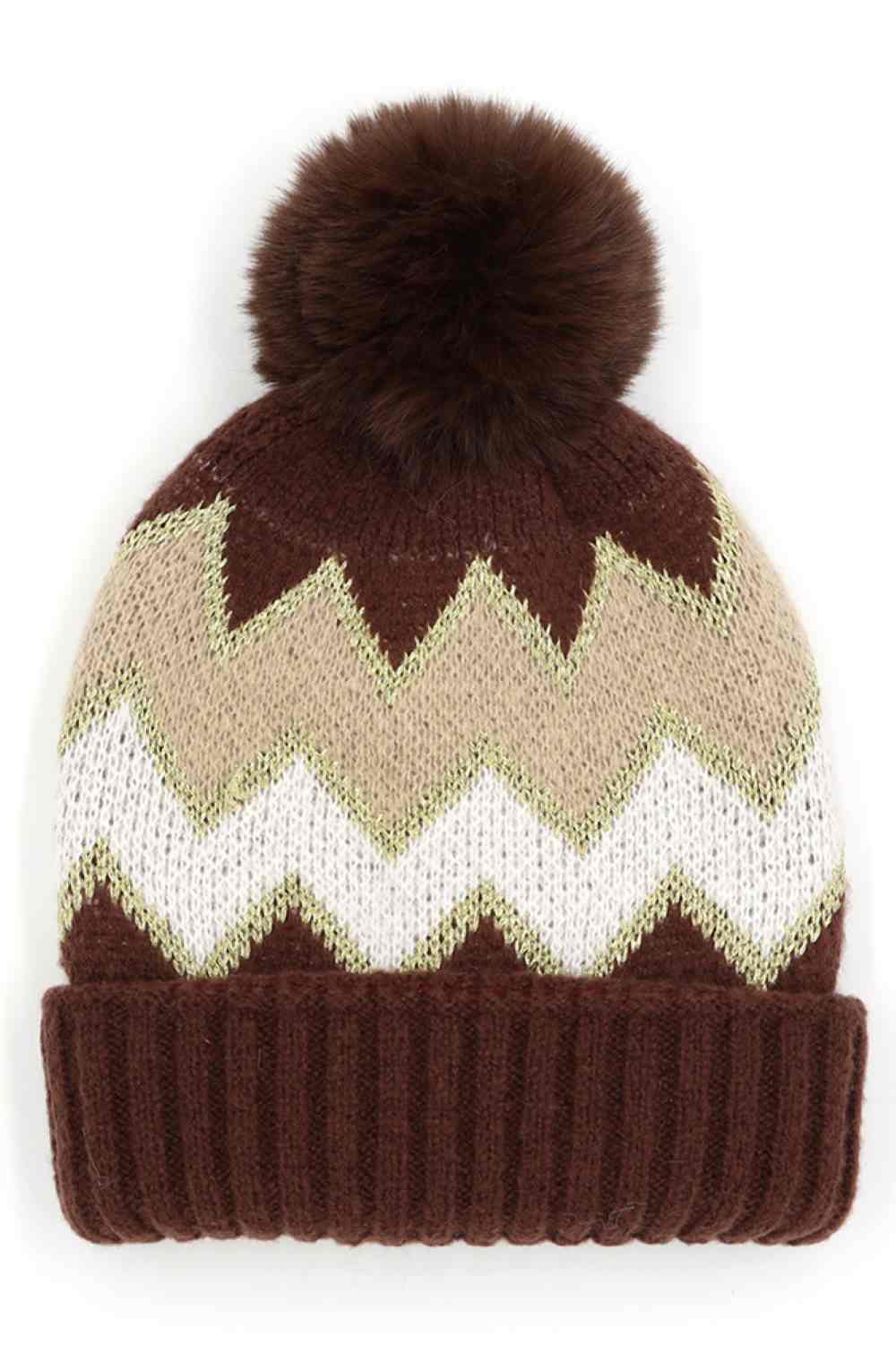 Brown Chevron PomPom Fuzzy Fleece Beanie features a bold chevron pattern with a soft, fuzzy fleece texture and a playful pompom for a cozy, stylish winter look. Designed with a comfortable stretch fit, it keeps you warm while adding fun flair to your cold-weather outfits.