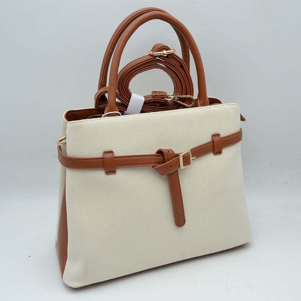 Brown Elevate your daily wardrobe with this sophisticated belted satchel. Combining the relaxed texture of a woven canvas body with the structure of sleek faux-leather trim, this handbag brings a tailored, high-end feel to any look. Perfect for professional environments, travel, or upscale weekend outings, its clean silhouette and distinctive knotted belt accent make it a timeless choice for the modern wardrobe.