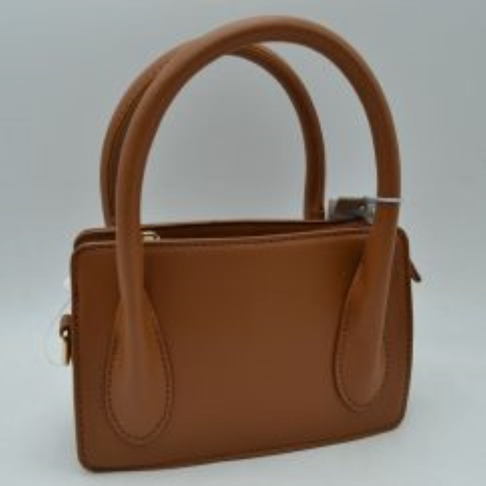 Brown This classic handbag features a structured rectangular silhouette with a smooth finish and clean stitched detailing, making it ideal for sophisticated everyday use. Designed with an open-top layout, it includes multiple divided storage compartments to keep your daily essentials organized and within reach. Dual arched top handles provide a comfortable grip for handheld carrying, while subtle metallic side rings offer a discreet attachment point for versatile styling options.