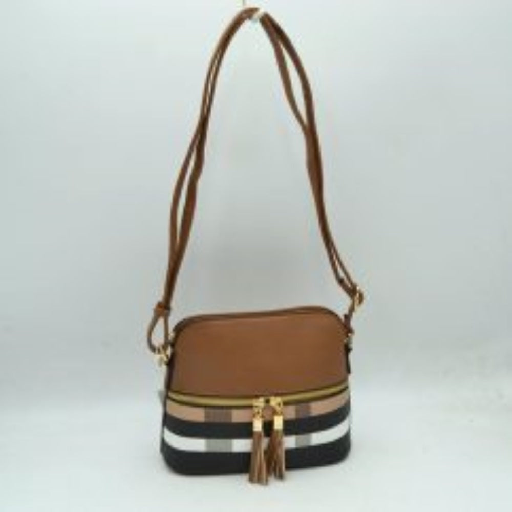 Brown This compact crossbody bag features a structured dome silhouette with a smooth upper half and a bold plaid pattern across the lower section, making it an excellent choice for everyday use. It offers multiple storage compartments, including a secure top-zippered main opening and a secondary front-zippered pocket embellished with dual gold-tone pulls and hanging tassels. A long, slender adjustable shoulder strap connects via metallic side rings