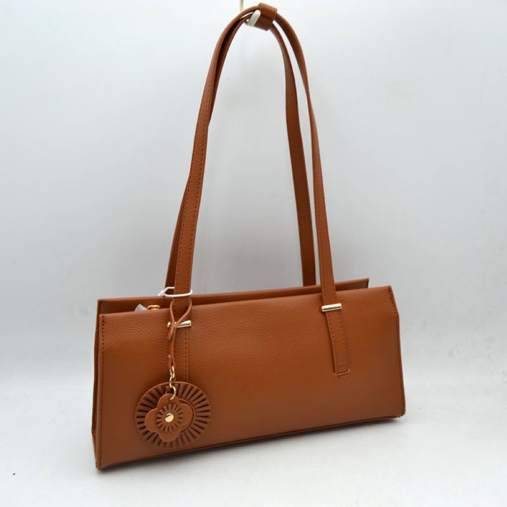 Brown Upgrade your everyday style with this sleek and sophisticated black shoulder tote bag. Designed with a modern rectangular silhouette, this handbag combines elegance and practicality for daily use. Crafted from textured faux leather, it features comfortable shoulder straps, a spacious interior, and a stylish decorative charm for a fashionable finishing touch. Perfect for work, shopping, casual outings, or evening occasions, this versatile bag complements both formal and casual wardrobes.