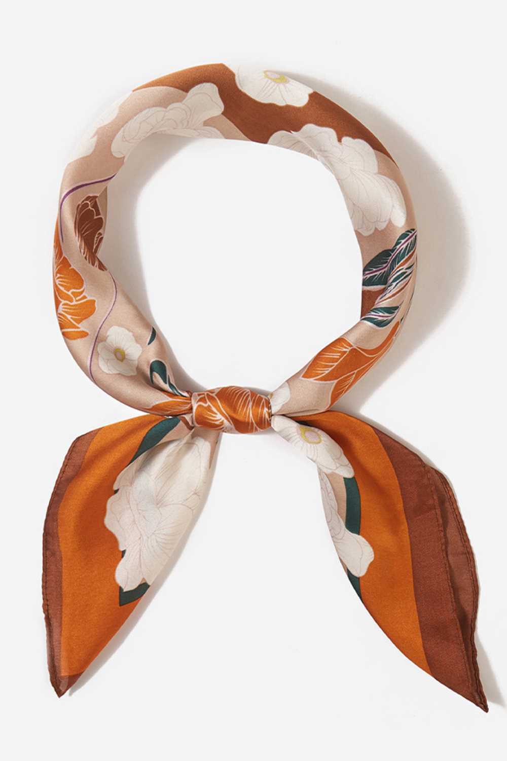 Brown Brighten your summer style with this charming floral pattern blocks bandana scarf. Crafted from lightweight 100% polyester, it's perfect for warm weather wear tie it around your neck, head, or wrist for effortless versatility. The generous 27.5" x 27.5" square cut offers plenty of styling options. Whether you're heading to the beach, running errands, or adding a pop of color to any outfit, this easy-care scarf keeps you cool and fashionable all season long.