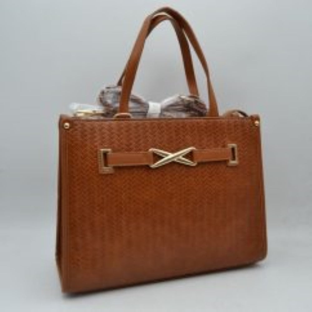 Brown This sophisticated everyday tote bag features a structured rectangular silhouette with an all-over classic basket-weave textured design in a clean beige tone. The front panel is elegantly accented by a matching faux-leather strap detailed with a polished, gold-toned 'X' shaped decorative buckle. Designed for organized professional or daily use, the main compartment is fitted with double slim top handles for comfortable hand or arm carrying.