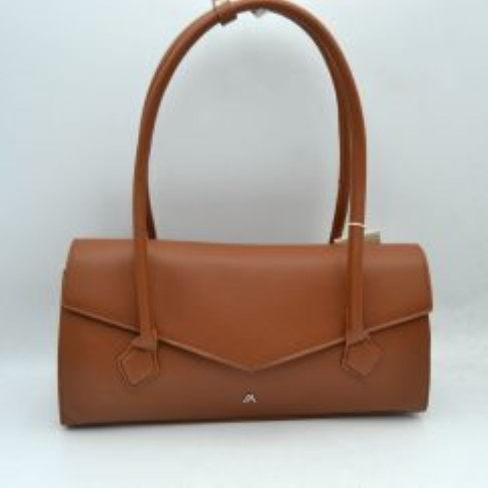 Brown This structured shoulder bag features a sleek, elongated East-West silhouette with a smooth exterior finish, making it a sophisticated choice for modern everyday use. The front panel is defined by an elegant envelope-style flap with a subtle pointed edge, highlighted by a minimalist metallic logo emblem near the bottom center. Equipped with long, rounded double shoulder straps that attach to the body with decorative stitched patches