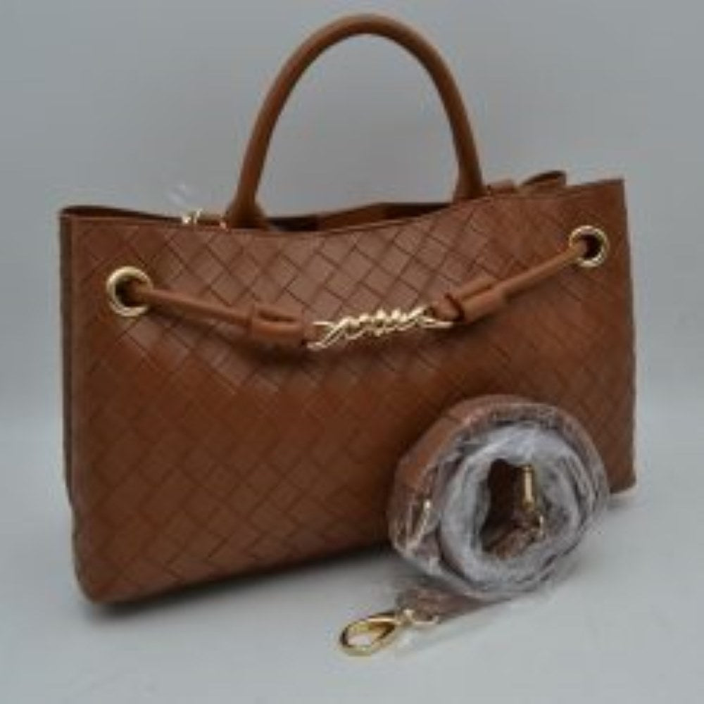 Brown Make a sophisticated statement wherever you go with this elegantly structured woven tote bag. Featuring a distinctive diagonal checkerboard weave pattern, this handbag brings a touch of modern luxury and rich texture to any wardrobe. The front is beautifully accented with a unique metallic centerpiece detail threaded through polished grommets, adding a contemporary twist to a classic silhouette. Designed for maximum versatility, it features comfortable dual top handles alongside a wrapped