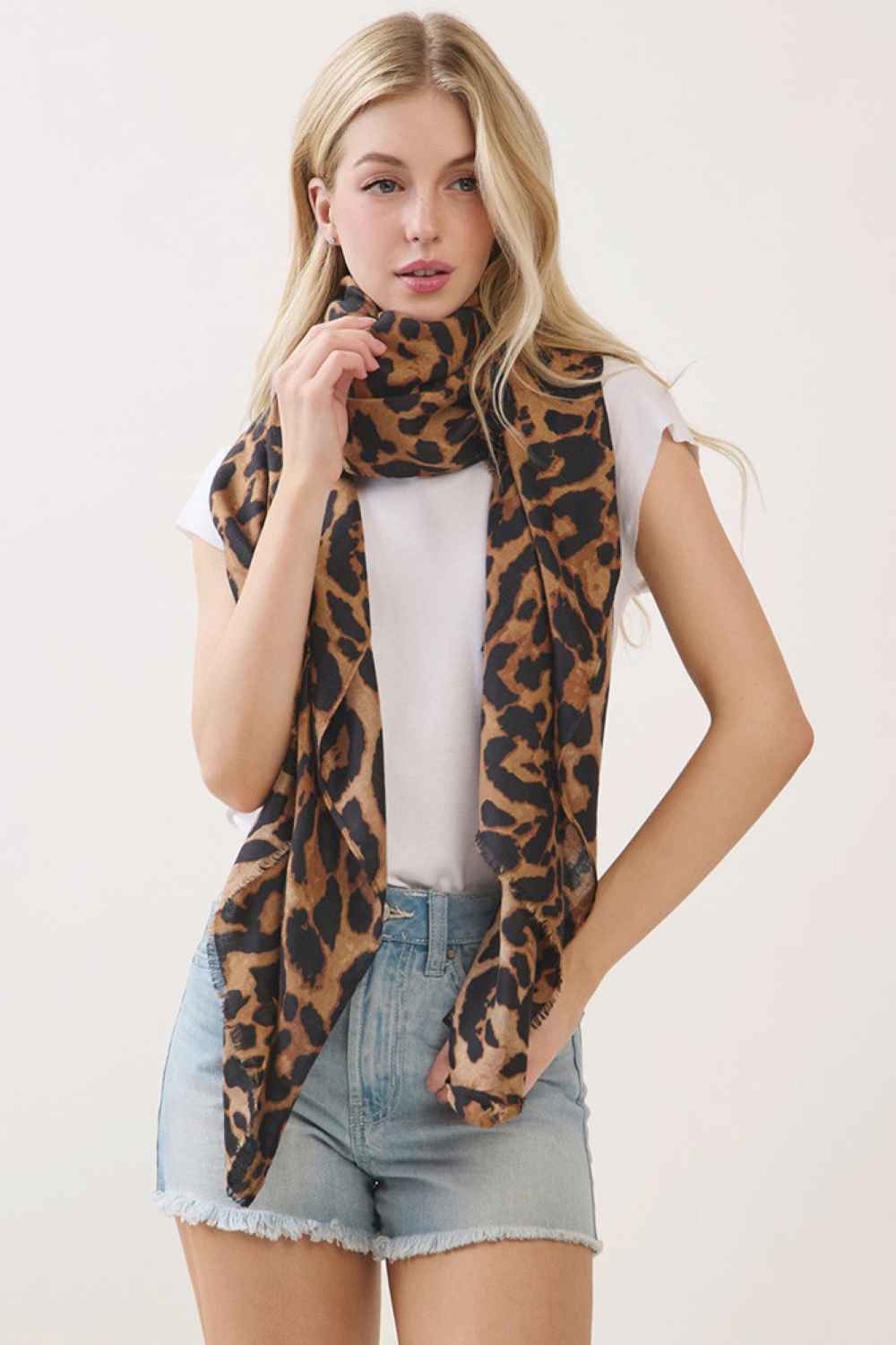 Brown Elevate your accessory game with this striking Leopard Pattern Print Oblong Scarf. Featuring a bold, timeless leopard print design, this versatile piece measures 35" x 70", making it perfect for draping, wrapping, or styling however you choose. Crafted from 100% polyester, it's lightweight, durable, and easy to care for. Whether you're layering for warmth or adding a pop of wild sophistication to your outfit, this scarf delivers effortless style. A must-have staple for any fashion-forward wardrobe.