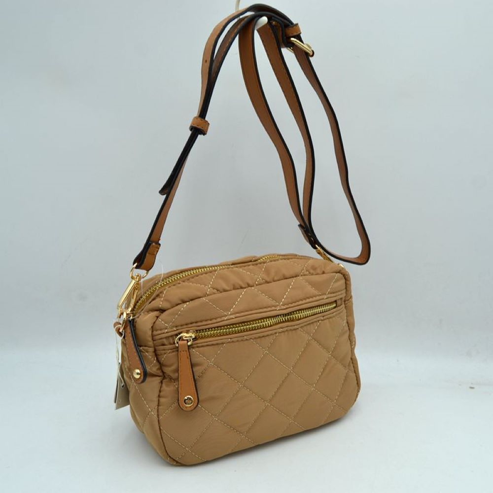 Brown Stay effortlessly organized on the move with this lightweight and stylish quilted crossbody bag. Combining a sporty nylon aesthetic with chic diamond quilting, this multi-pocket bag is the perfect accessory for travel, running errands, or everyday casual wear.