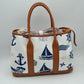 Brown Set sail with this nautical-inspired canvas tote. Featuring a crisp backdrop decorated with a classic print of anchors, sailboats, ship wheels, and ocean waves, this bag is the perfect accessory for coastal getaways or adding maritime flair to your daily ensemble. Framed with structured textured trim, it balances casual resort style with sharp, everyday functionality.