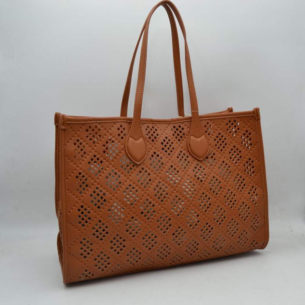 Brown Elevate your accessory game with this stunning black perforated tote. Combining architectural precision with everyday practicality, this bag features an intricate laser-cut lattice design that offers a modern, airy feel while maintaining a structured, high-end silhouette. Whether you're heading to a business meeting or a weekend brunch, this versatile tote is the perfect blend of edgy detail and classic sophistication.