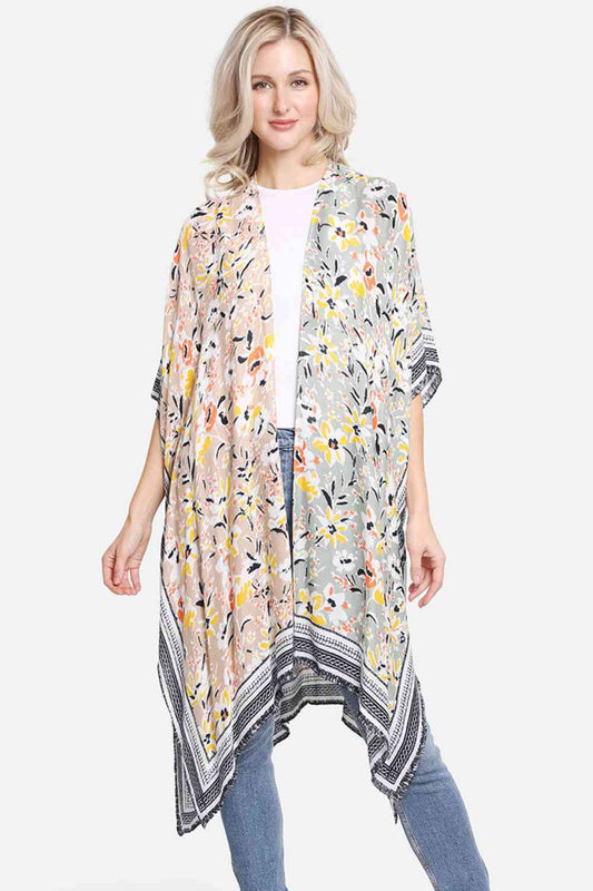 Brown Effortless summer style meets comfort in this vibrant multi-colored floral pattern cover-up. Crafted from 100% viscose, the lightweight fabric drapes beautifully while keeping you cool and comfortable. Perfect for beach days, poolside lounging, or casual outings, this versatile piece transitions seamlessly from day to night. Dimensions: 38" x 39". Made in China.