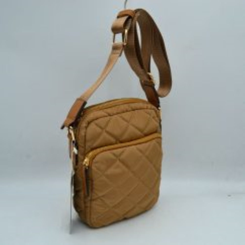Brown This structural trapeze handbag showcases a clean exterior finish and distinct flared side panels, offering an elegant aesthetic for everyday use. It features unique rounded top handles shaped like segmented bamboo rings, which are attached securely via wide decorative tabs and metallic hardware on the front and back. A top zipper closure with an extended pull tab opens up to a secure main storage compartment, keeping all your essential items safe and neatly organized.