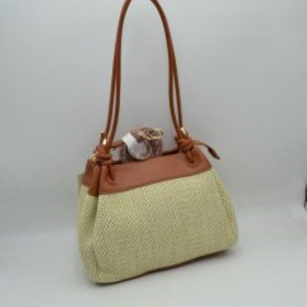 Brown Embrace a relaxed yet sophisticated aesthetic with this beautifully textured shoulder bag. The design prominently features a classic woven mesh panel across the main body, paired seamlessly with smooth trim along the upper edge and base. Dual slender shoulder straps attach to the bag with elegant, integrated knot details at the base, offering a comfortable drop for easy over-the-shoulder carrying. 