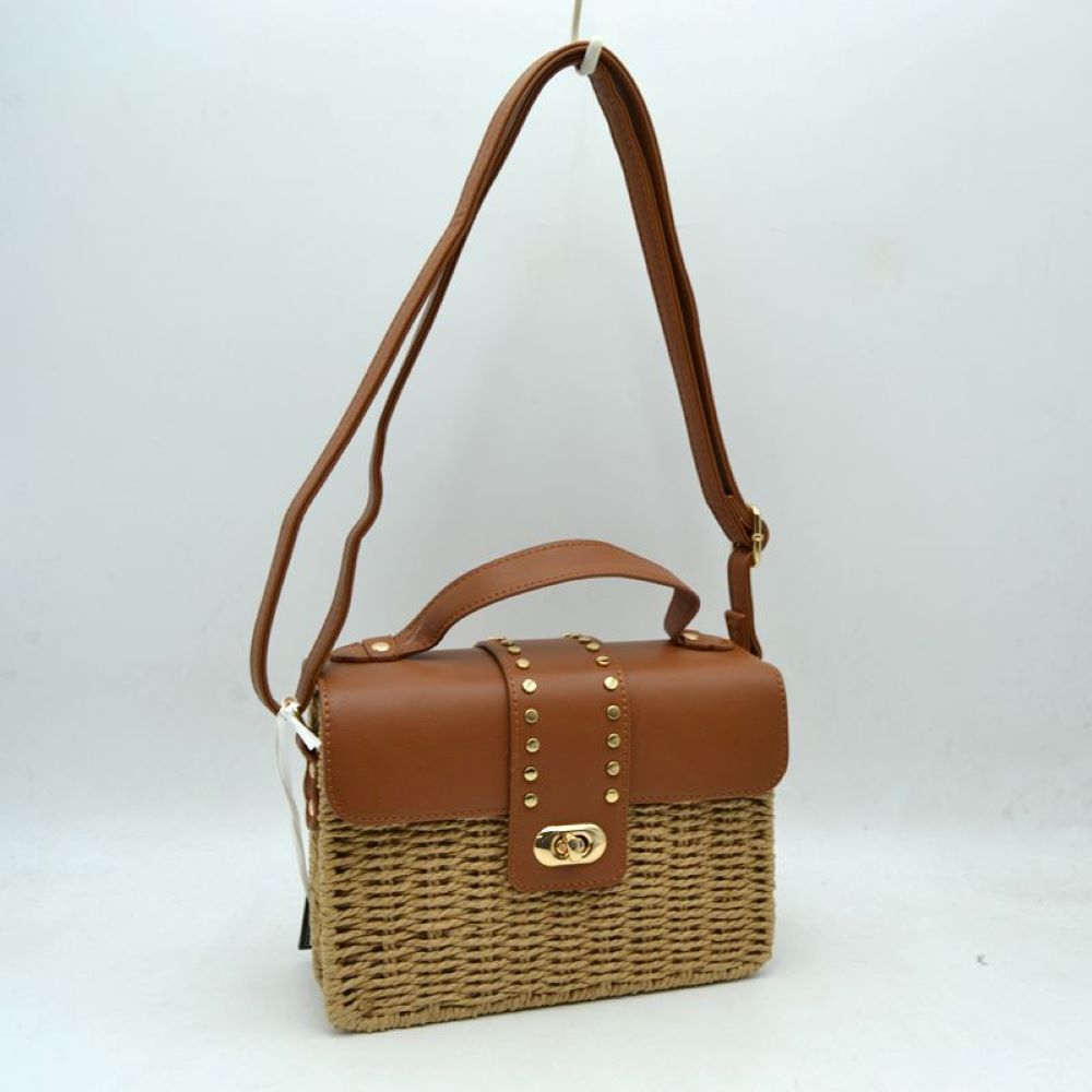 Brown Embrace warm-weather sophistication with this beautiful mixed-media shoulder bag. Effortlessly blending the rustic, organic charm of a woven straw basket body with a smooth, structured faux-leather flap enclosure, this bag is a must-have accessory for casual sunny days, resort vacations, or stylish weekend brunches. Its elegant silhouette offers a refined twist on classic beachwear aesthetics, transitioning perfectly from a day in the sun to an evening out.
