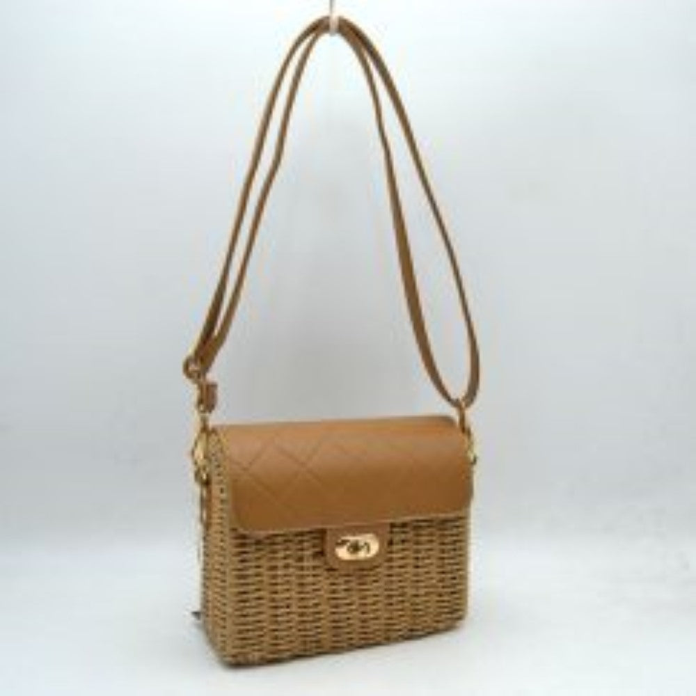 Brown Add a touch of effortless charm to your ensemble with this beautiful woven crossbody bag, perfect for warm-weather outings, vacation days, or casual weekend brunch. Combining natural, textured appeal with structured sophistication, this accessory features an intricate woven body paired with a classic quilted top flap. The secure turn-lock closure on the front keeps your essentials safe while adding a polished accent to the overall design.