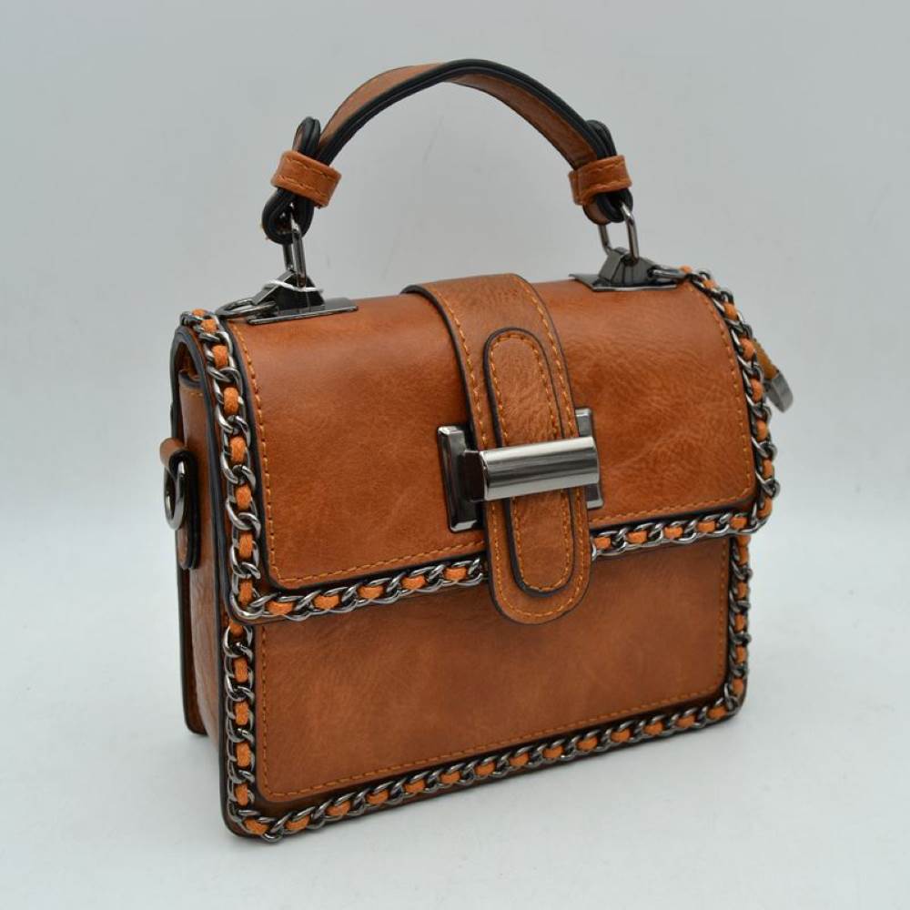 Brown Add a touch of structured elegance to your look with this chic top-handle satchel bag. Designed for the modern trendsetter, it seamlessly blends classic vintage vibes with contemporary edgy accents.
