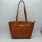 Brown Elevate your daily style with this timeless and beautifully detailed structured shoulder tote bag. Blending a classic, elegant trapeze silhouette with gorgeous textured detailing, this bag serves as the perfect sophisticated accessory for work, shopping, or everyday outings.