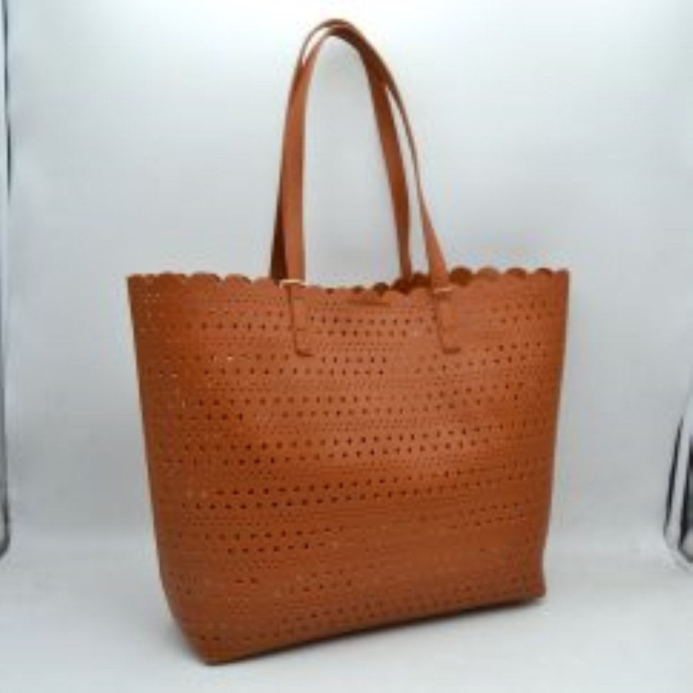 Brown Bring an airy, classic look to your everyday style with this elegant perforated tote bag. Featuring an all-over laser-cut geometric pattern arranged in neat horizontal rows, this handbag stands out with its feminine, scalloped top border. The generously sized interior offers plenty of room to hold your daily essentials, electronics, or beach necessities, making it a perfect match for seasonal travel, market runs, or casual daytime outings.