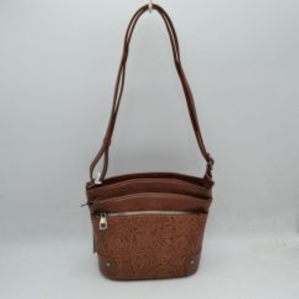 BrownThis functional crossbody bag features an elegant embossed floral pattern along the lower panel and a classic structured silhouette, ideal for daily organization. Designed with multiple storage options, it includes two main top-zippered compartments and a front zippered pocket with metallic hardware pull tabs to keep your essentials organized. A long, adjustable shoulder strap allows for comfortable, hands-free carrying over the shoulder or across the body.
