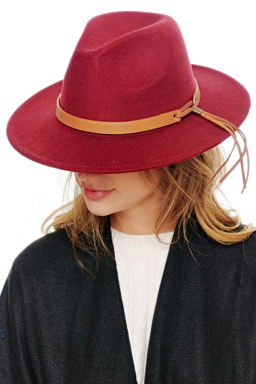 Burgundy Felt solid Fedora hat offers timeless sophistication with exceptional durability. The classic silhouette features a structured crown and well-proportioned brim that provides both style and practical sun protection. Its versatile design transitions seamlessly from casual to formal occasions, making it an essential addition to any discerning wardrobe.