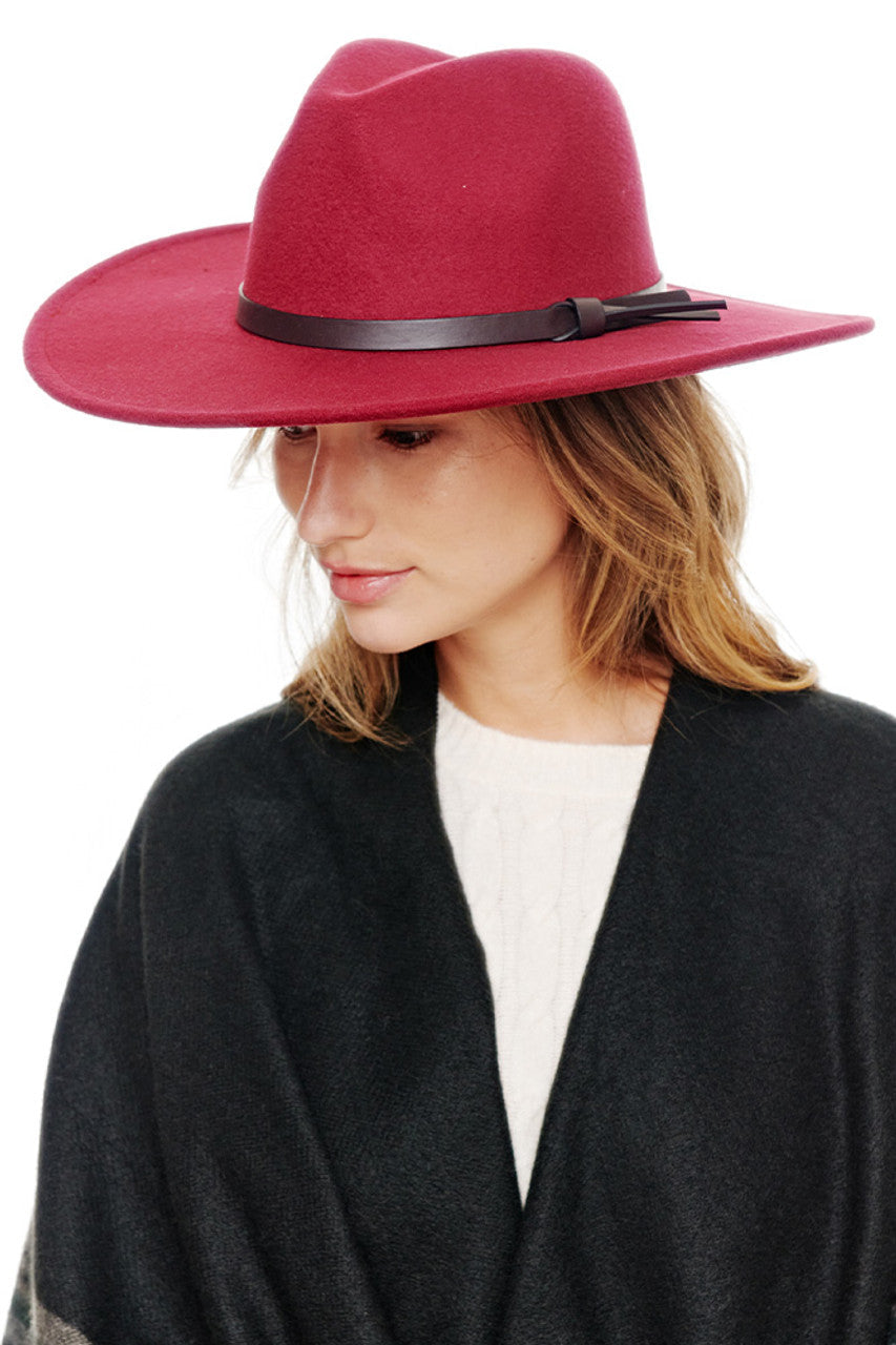 Burgundy Felt Wide Brim Fedora Hat offers sophisticated style with practical sun protection. The classic silhouette features a structured crown and generous brim that maintains its shape throughout wear. Perfect for elevating casual outfits or complementing formal attire across all seasons.