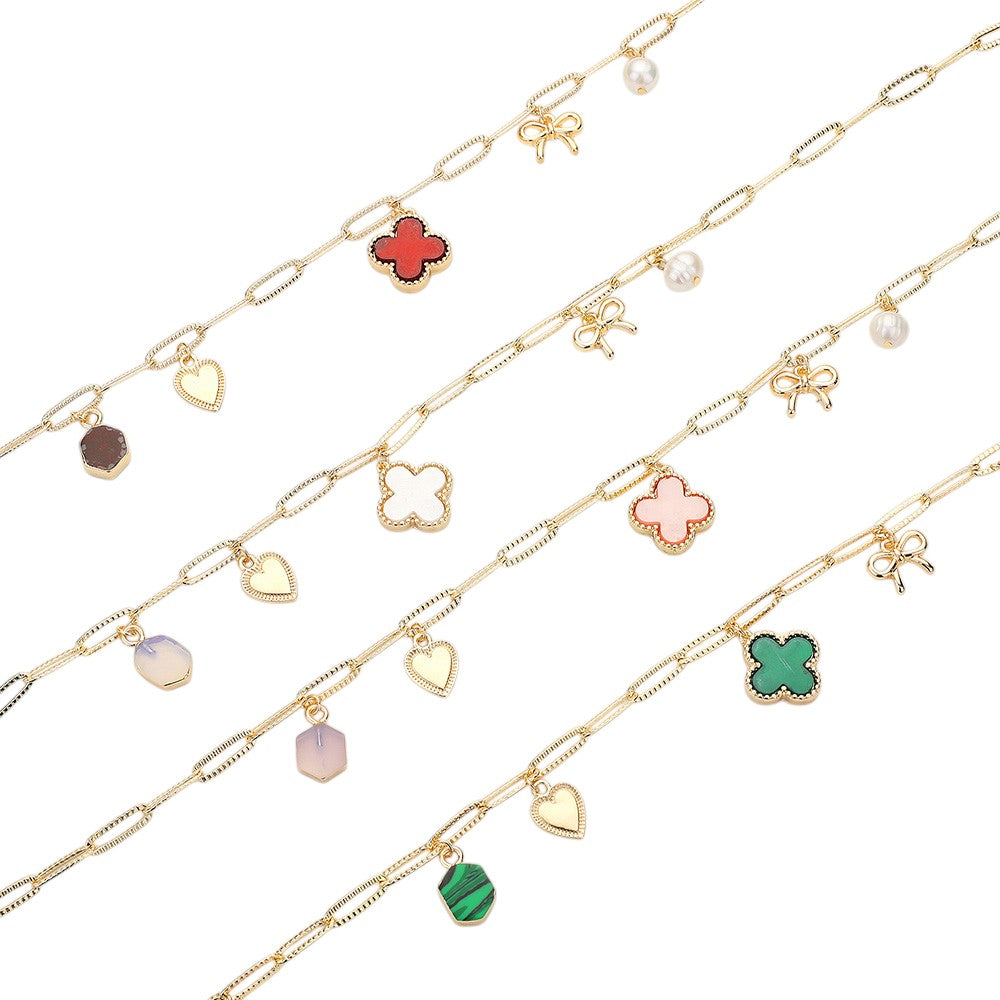 Quatrefoil Bow Heart Pearl Charm Station Paperclip Chain Necklace is expertly crafted with a unique design, combining a delicate paperclip chain with charming quatrefoil, bow, and pearl details. Made with high-quality materials, this necklace is elegant and versatile, perfect for any occasion.