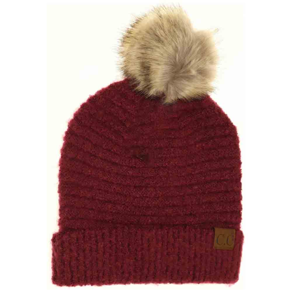 Burgundy Solid Boucle Knit Pom CC Beanie combines texture and warmth through its soft boucle knit fabric. Designed for expert-level comfort, this beanie features a classic silhouette topped with a playful pom for a refined yet casual look. Ideal for cold weather, it offers durable insulation while maintaining breathability, making it a versatile accessory for everyday wear. 