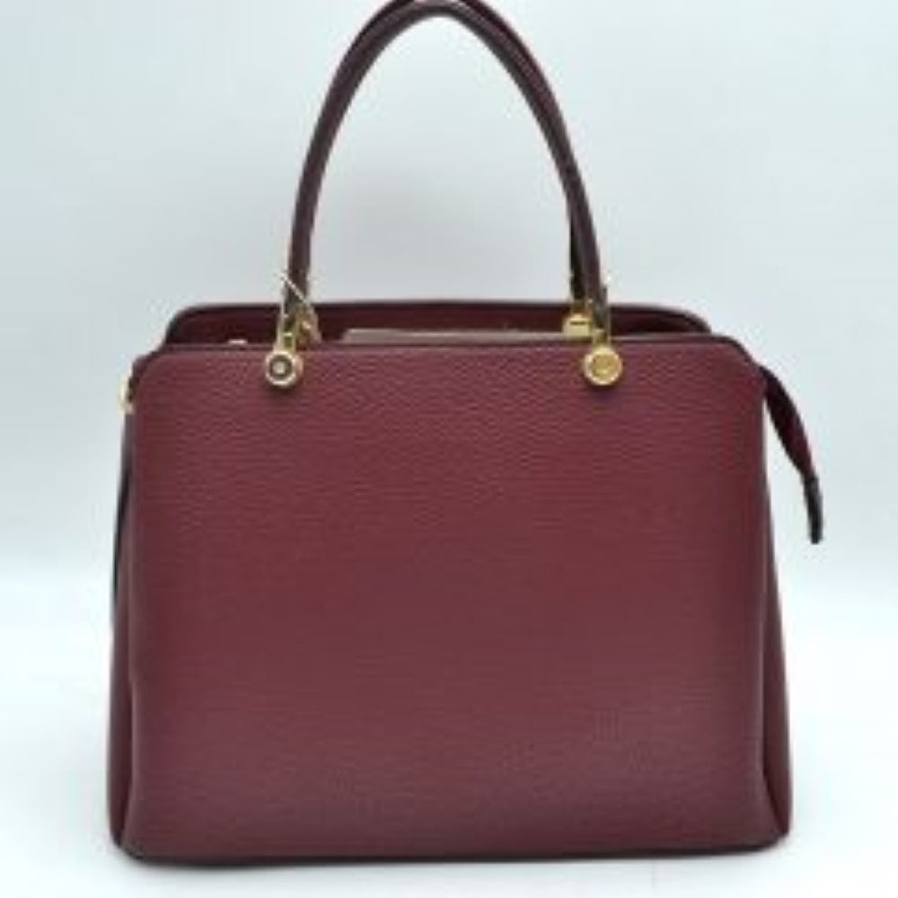Burgunday This structured handbag is designed for everyday use, featuring dual arched top handles attached with round metallic hardware. The design includes multiple storage compartments to organize your belongings, featuring a central zippered closure alongside separate side compartments.