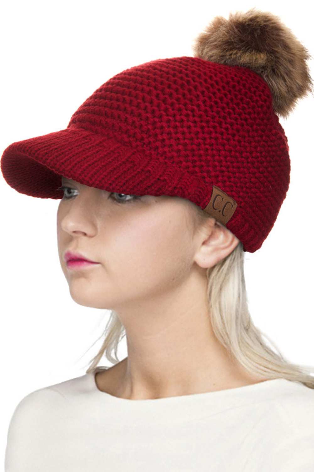 Burgundy Elevate your winter wardrobe with this versatile C.C knit brim beanie, crafted from 100% soft acrylic for exceptional comfort and durability. The signature knitted brim design pairs beautifully with a plush fur pom pom, adding a touch of sophistication to any cold-weather look. One size fits most, making it an effortless accessory choice for anyone seeking warmth without compromising on style. Perfect for layering or standalone wear, this beanie delivers both functionality and fashion