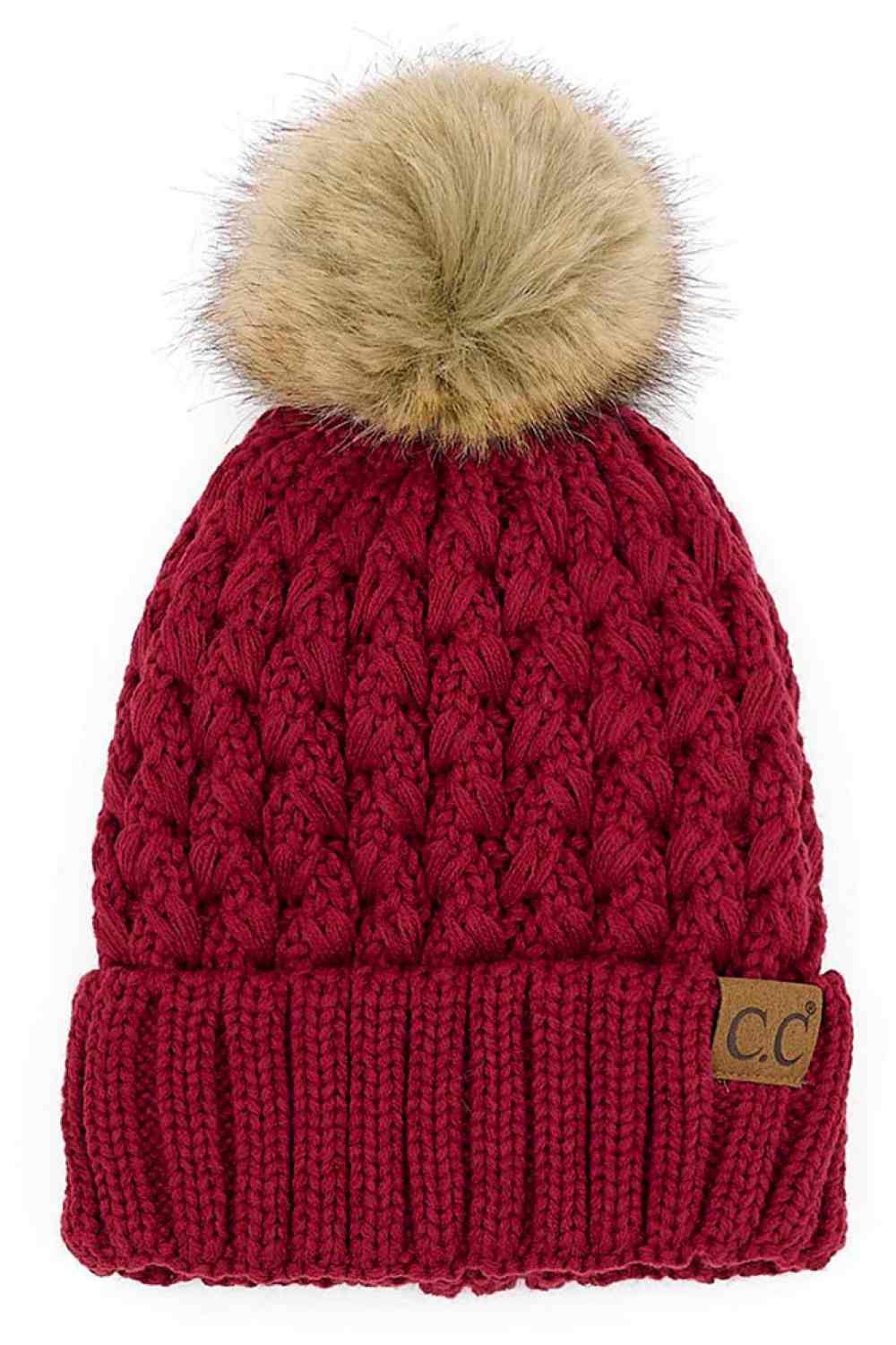Burgundy Elevate your winter wardrobe with the C.C Lattice Crossover Stitch Beanie, featuring an intricate lattice pattern and cozy pom detail. Crafted from 100% soft acrylic, this beanie delivers warmth and comfort without the weight. The crossover stitch design adds visual interest while the relaxed fit suits most face shapes. Perfect for layering over your favorite winter looks, this versatile beanie transitions effortlessly from casual outings to outdoor adventures. One size fits most for easy, everyday