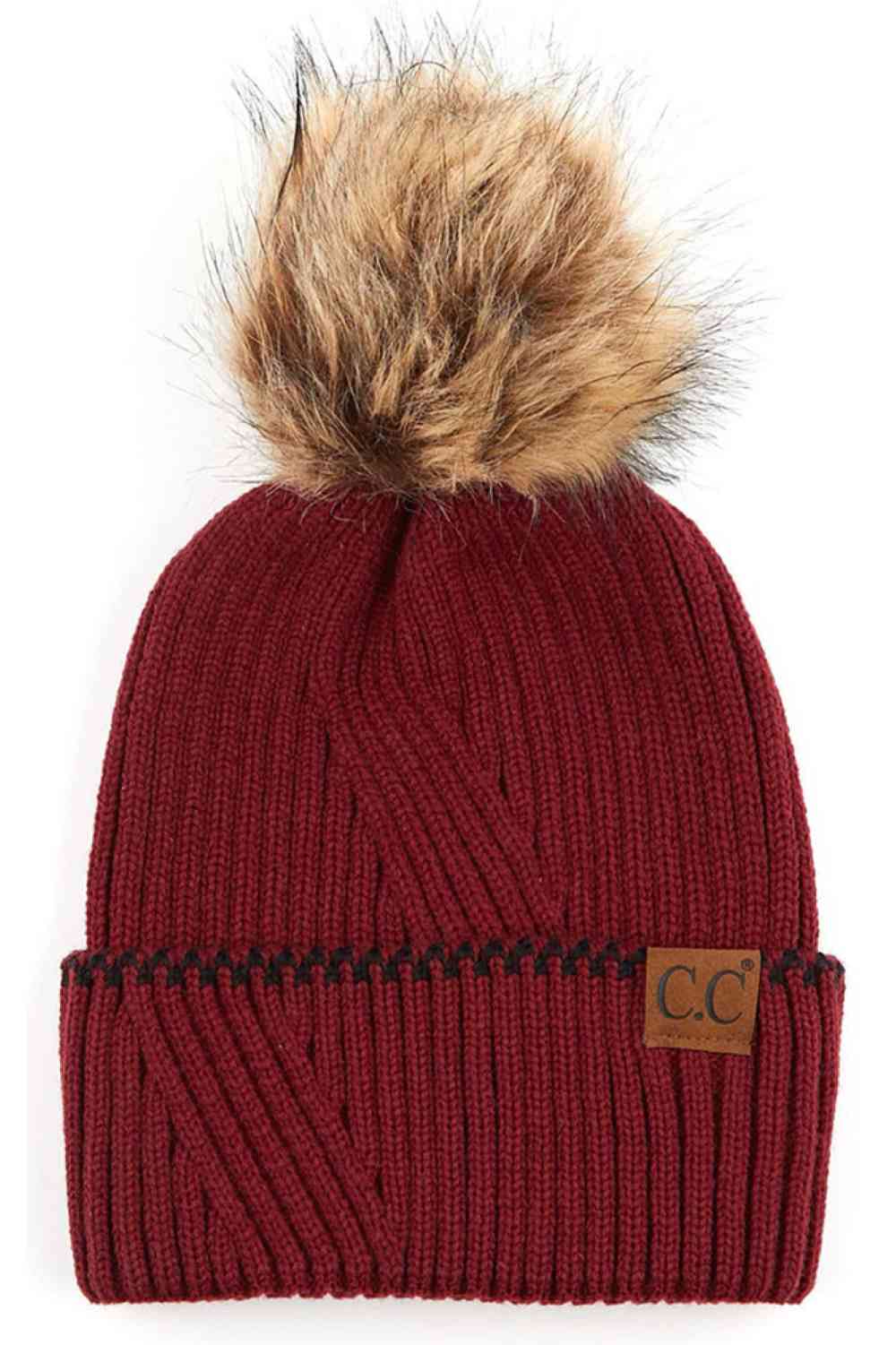 Burgundy C.C Solid Pom Beanie with Accented Cuff Stay warm and stylish with this classic C.C solid pom beanie, designed for everyday comfort. Made from 100% acrylic, this lightweight knit offers softness and durability through winter seasons.