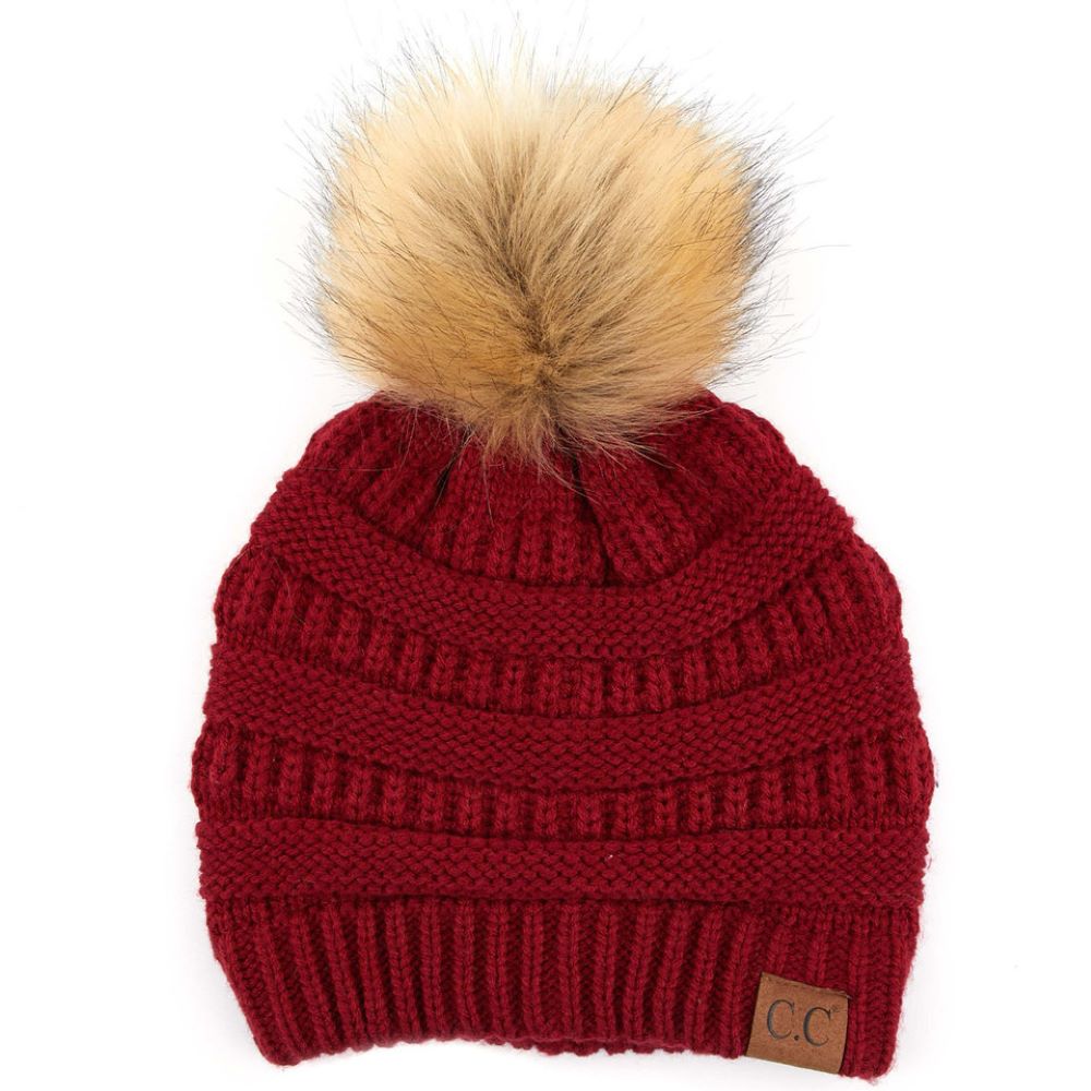 Burgundy Stay warm and cozy with this classic C.C Pom Pom Knit Beanie, crafted from 100% soft acrylic for all-day comfort. The ribbed knit design adds texture and durability, while the signature pom pom on top brings a playful touch to any winter outfit. One size fits most, making it the perfect accessory for everyone. Ideal for cold weather adventures or casual everyday wear.