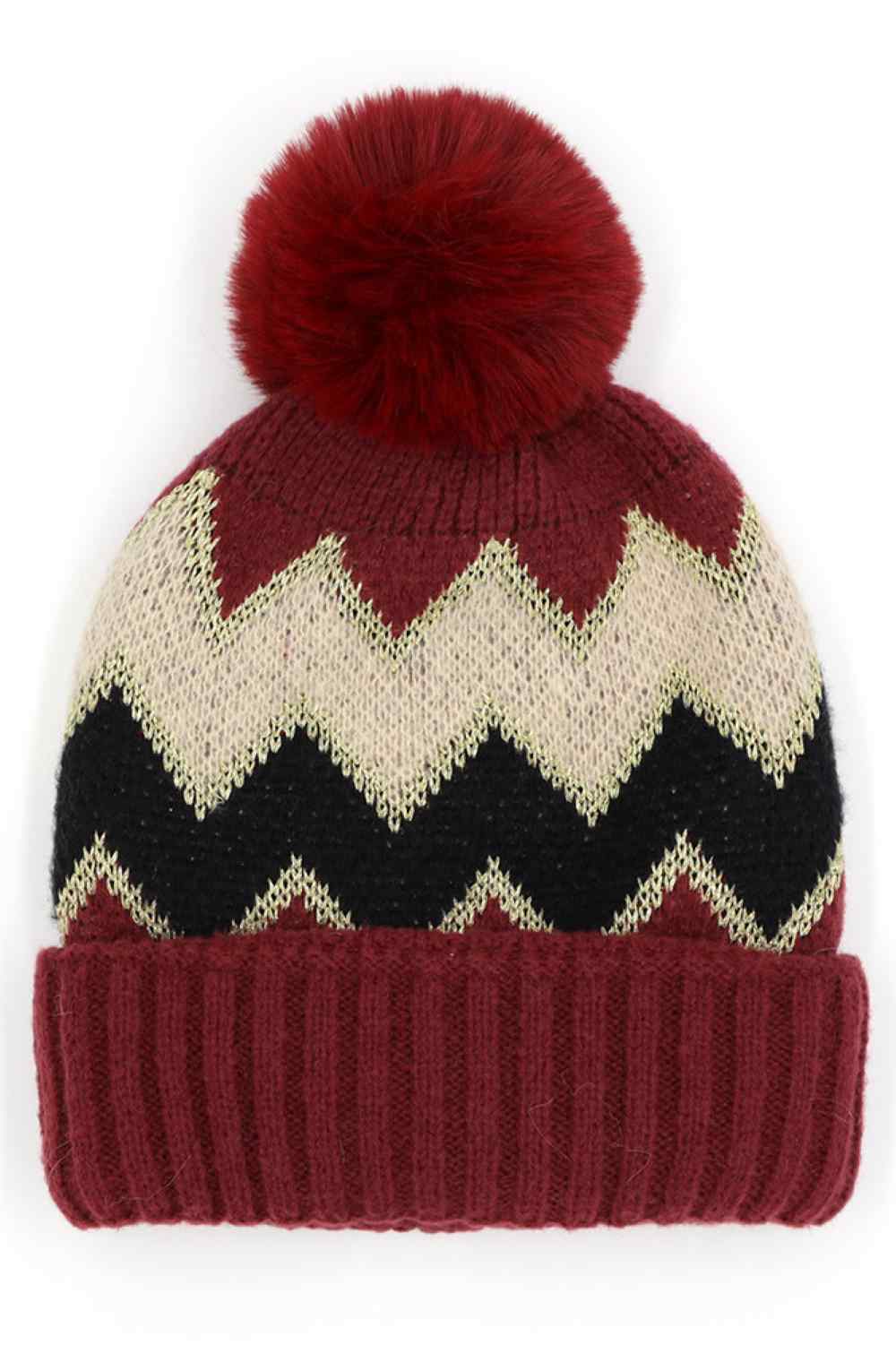Burgundy Chevron PomPom Fuzzy Fleece Beanie features a bold chevron pattern with a soft, fuzzy fleece texture and a playful pompom for a cozy, stylish winter look. Designed with a comfortable stretch fit, it keeps you warm while adding fun flair to your cold-weather outfits.