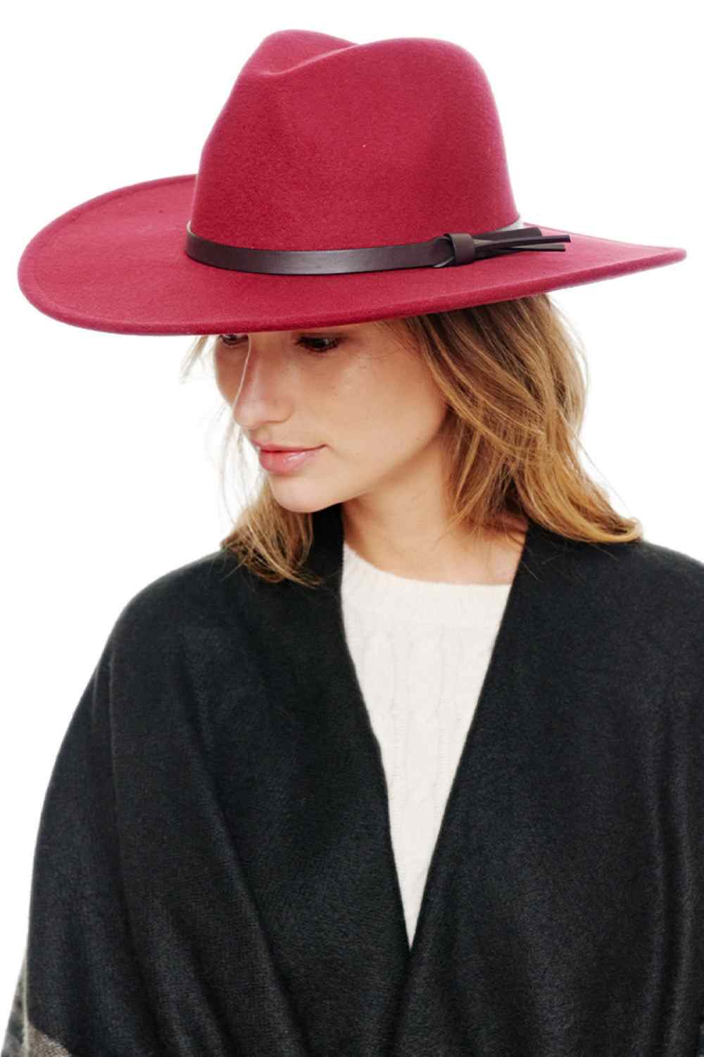 Burgundy Elevate your accessory game with this versatile Felt Wide Brim Fedora Hat. Constructed from 100% polyester, it delivers a luxuriously soft, suede-like feel that's both comfortable and durable. The wide brim and structured crown create a polished silhouette perfect for any occasion—from casual outings to dressed-up events.