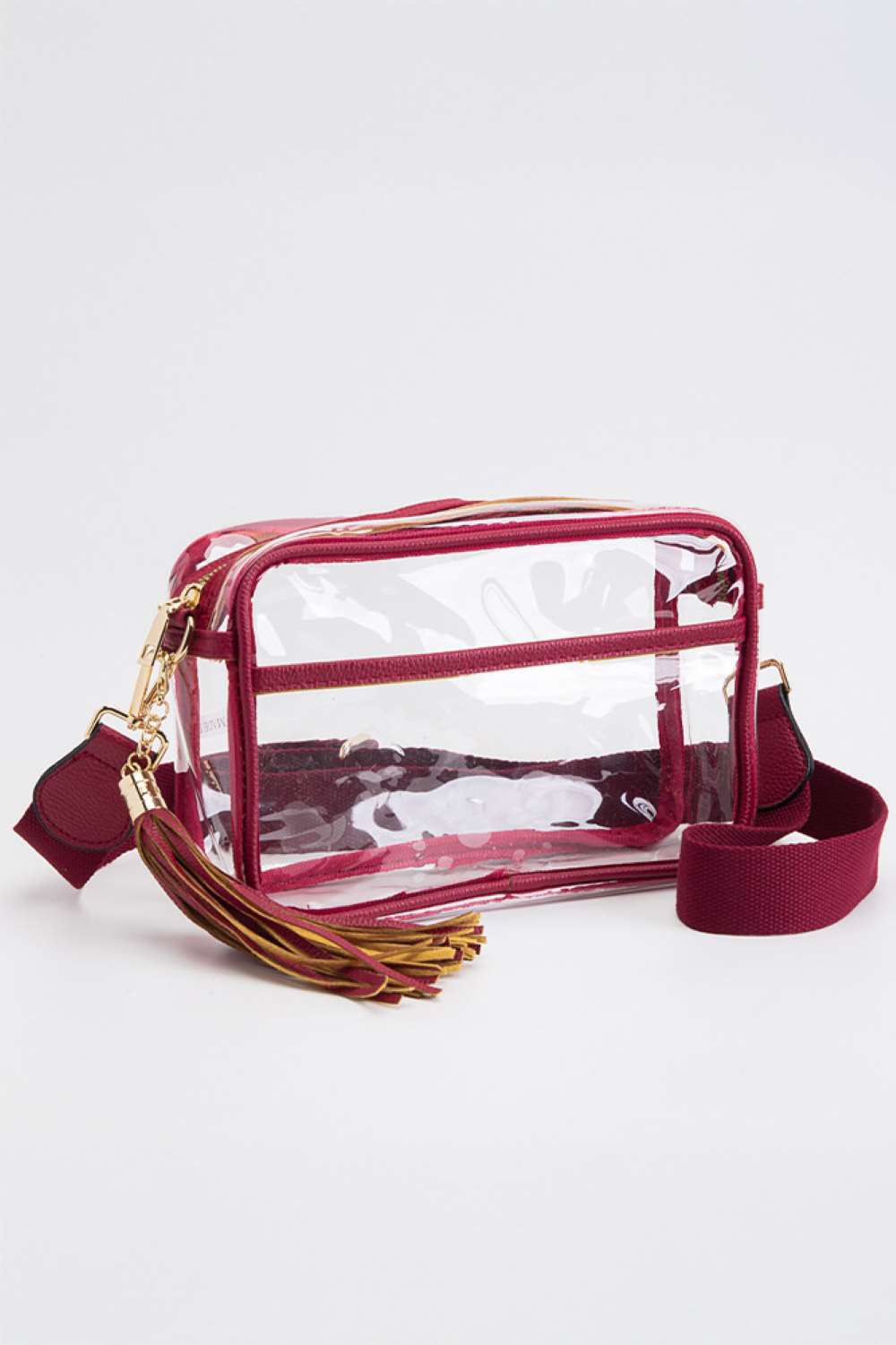 Burgundy Clear PU Cross Body Camera Bag offers a sleek, transparent design crafted from durable polyurethane, providing both style and protection for your camera gear. Its crossbody strap ensures comfortable, hands-free carrying, while the clear material allows quick visibility of contents for easy access. Ideal for photographers seeking a practical yet modern solution to transport and safeguard their equipment.