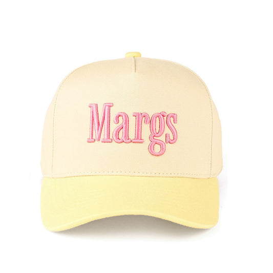 Butter Yellow CC Beanie “MARGS” Lettering Two-Tone Trucker Baseball Snapback Cap features bold embroidered lettering with a stylish two-tone design for a fun, casual look. The classic trucker silhouette with a snapback closure offers breathable comfort and an adjustable fit for everyday wear.