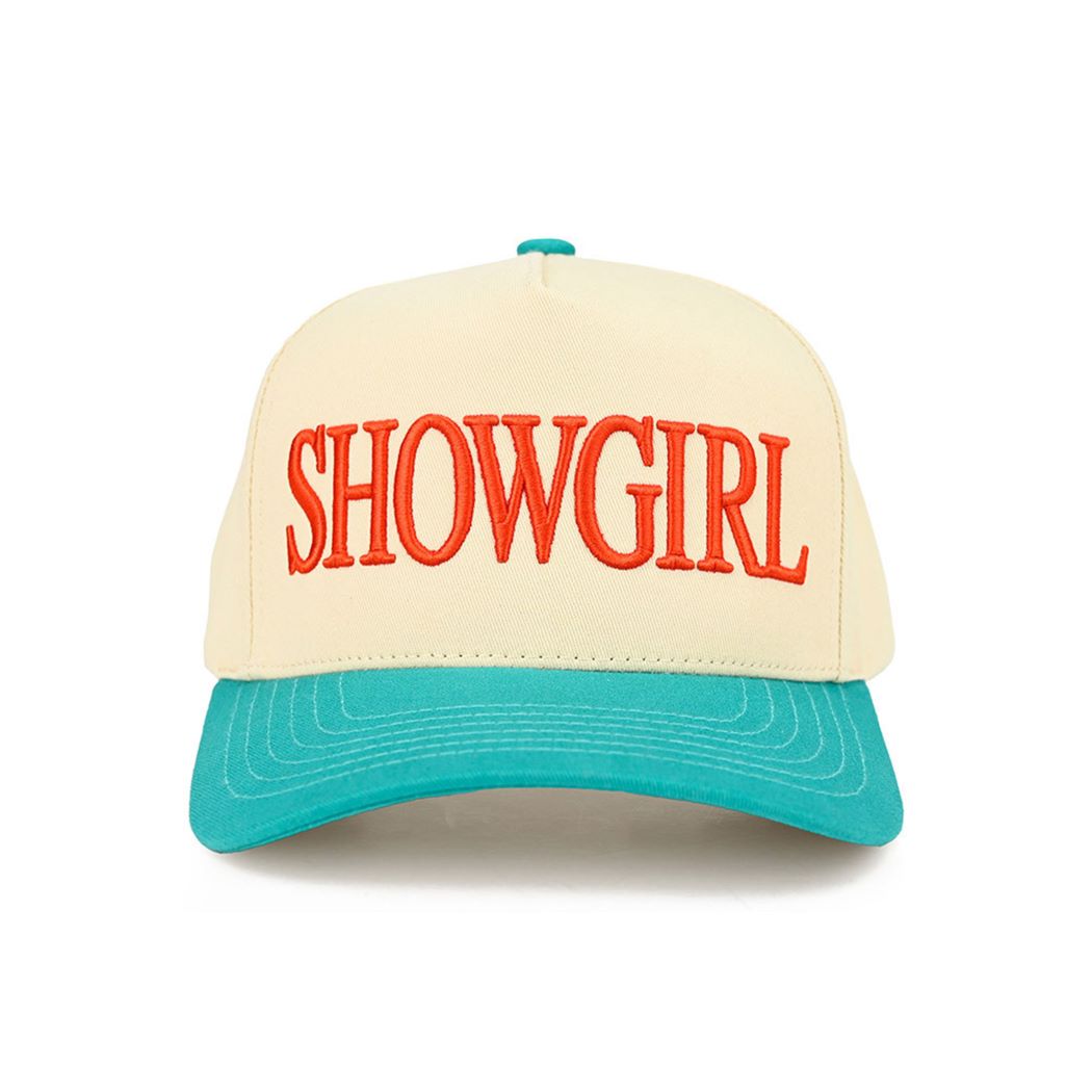 Turquoise The C.C SHOWGIRL Letter Two-Tone Trucker Cap features bold “SHOWGIRL” lettering with a stylish two-tone design for a standout, fashion-forward look. Finished with a breathable mesh back and adjustable snap closure, it offers lightweight comfort and a customizable fit for everyday wear.