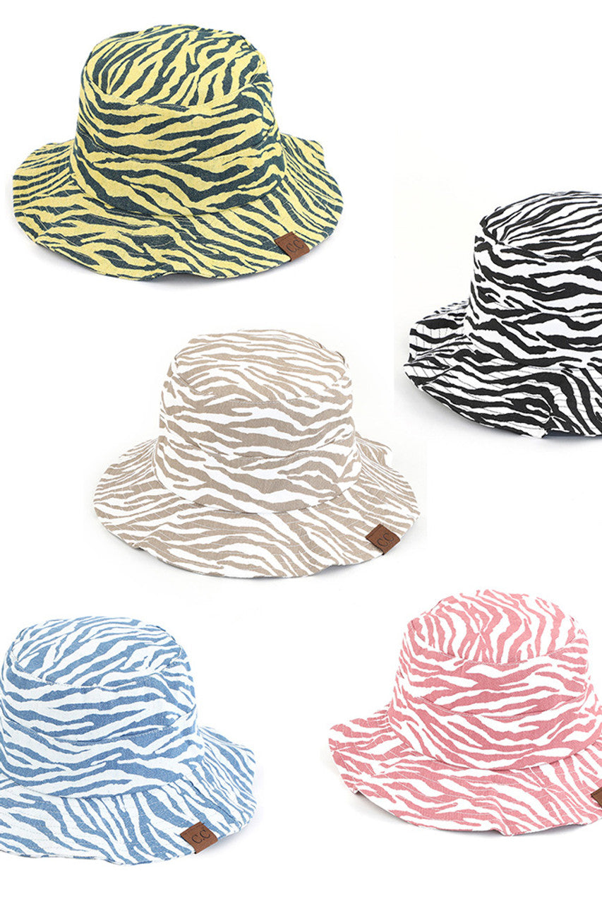 C.C. ZEBRA PRINT BUCKET HAT is the perfect accessory for any outdoor adventure. Made from high-quality materials, it offers both style and functionality. Stay protected from the sun and make a statement with its bold zebra print design. Trust in C.C. for expertly crafted hats.