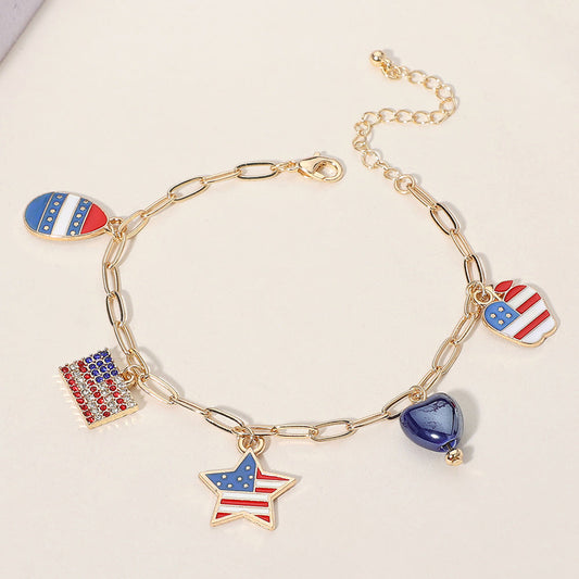 Madeline Love Gold, Multi Enamel American USA Flag Star Apple Egg Heart Charm Station Paperclip Chain Bracelet - Bracelets