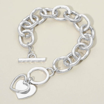 Madeline Love Rhodium, Worn Silver Hammered Layered Heart Charm Chunky Chain Toggle Bracelet - Bracelets