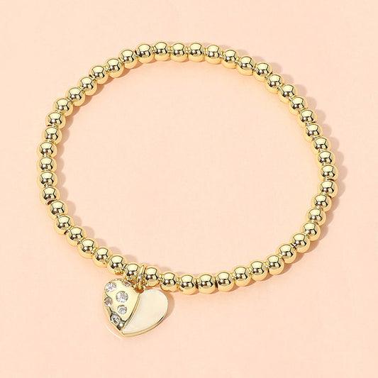 Madeline Love Gold Stainless Steel Heart Charm Beaded Stretch Bracelet