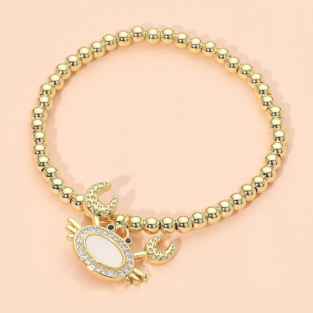 Madeline Love Gold, Mother of Pearl Stainless Steel Mother of Pearl CZ Stone Paved Crab Charm Beaded Stretch Bracelet - Jewelry