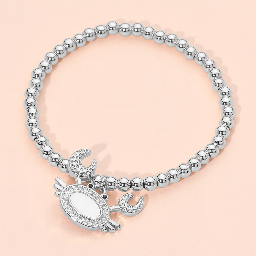 Madeline Love Mother of Pearl, Silver Stainless Steel Mother of Pearl CZ Stone Paved Crab Charm Beaded Stretch Bracelet - Jewelry