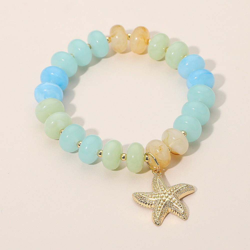 Madeline Love Aqua, Gold Textured Metal Starfish Charm Accent Resin Pebble Beaded Stretch Bracelet - Bracelets