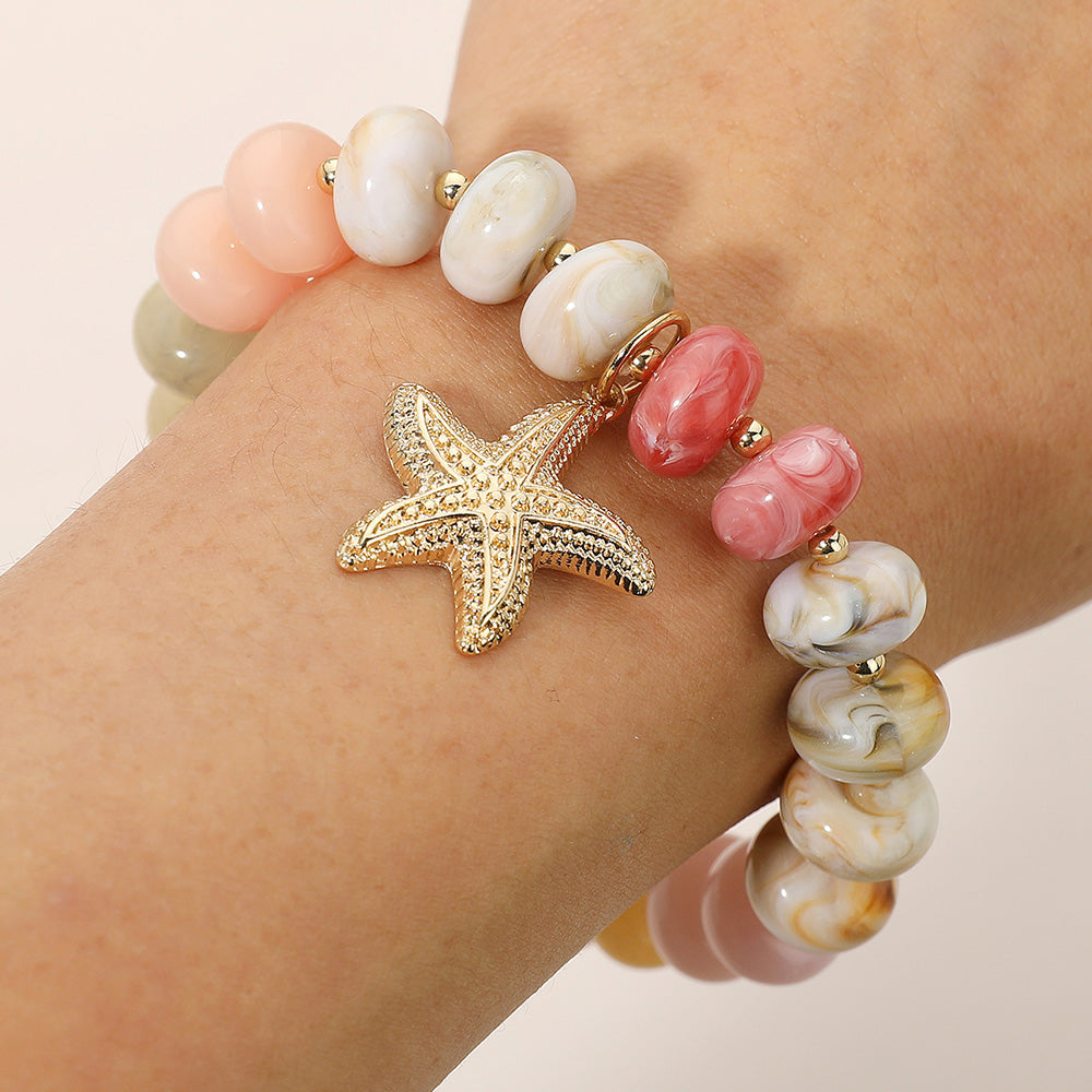 Madeline Love Beige, Gold Textured Metal Starfish Charm Accent Resin Pebble Beaded Stretch Bracelet - Bracelets